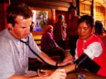 Hengli examining patients in ge bai kong